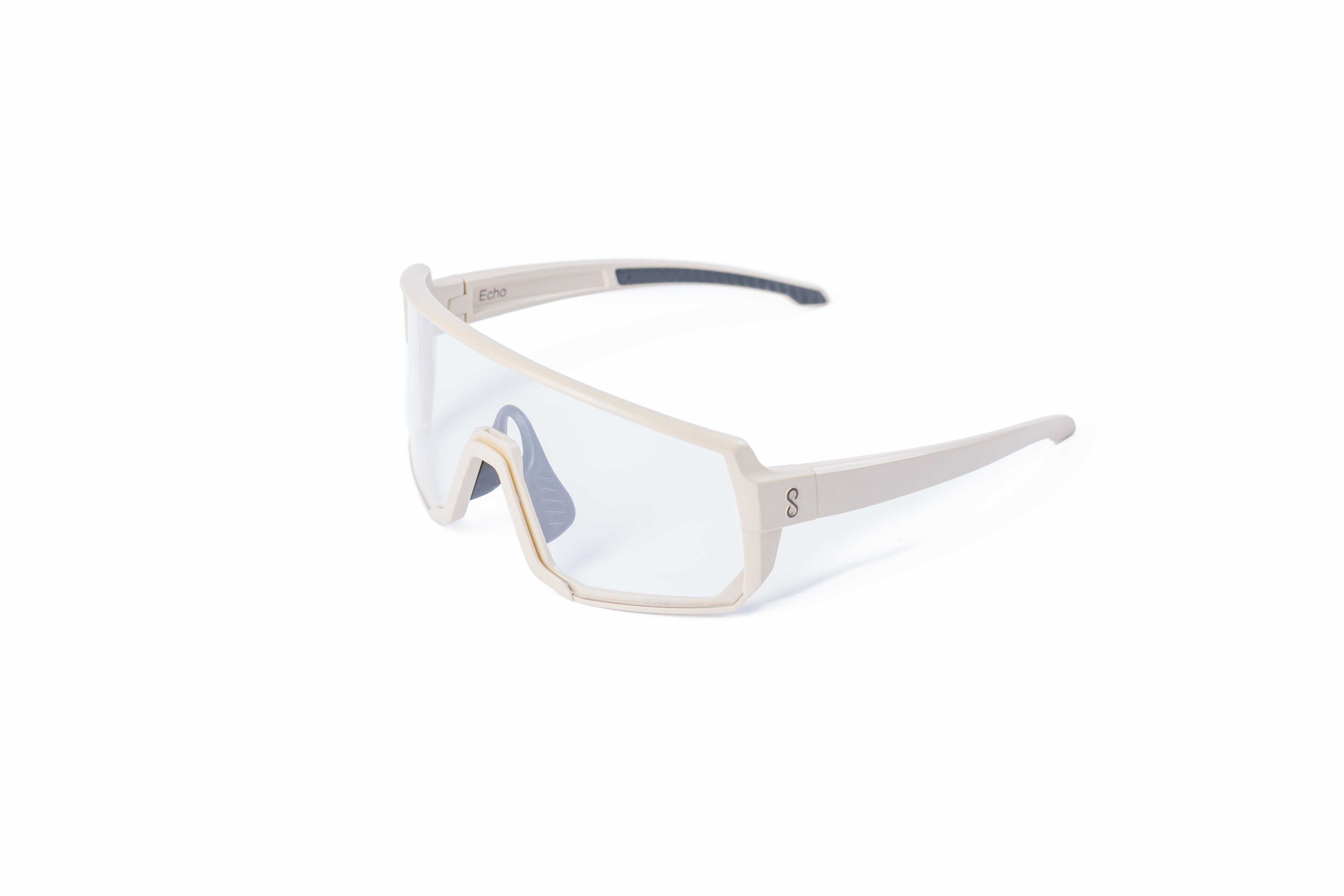 Small size cream sunglasses with an interchangeable clear lens on a white background