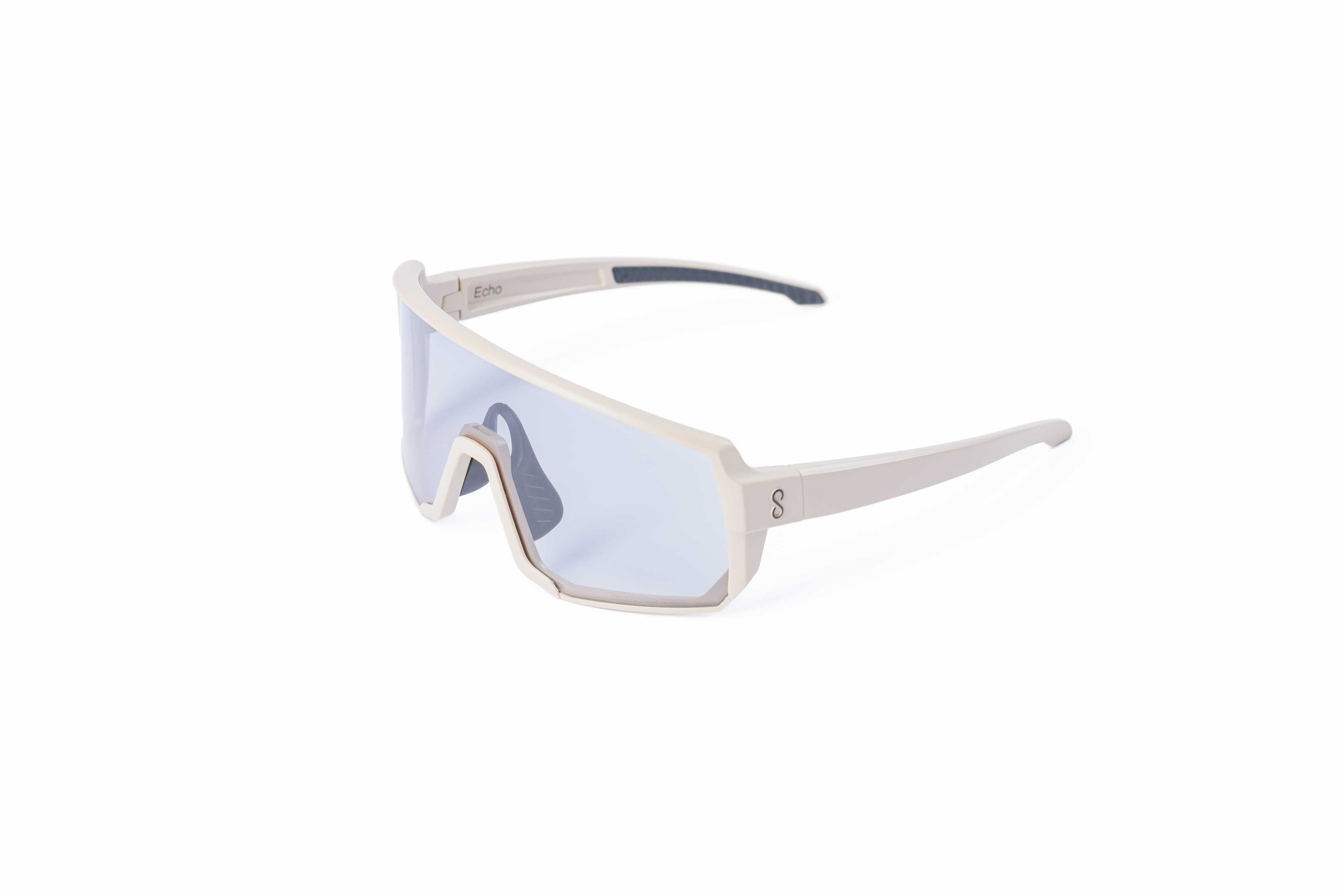 Small size cream sunglasses with an interchangeable photochromatic lens on a white background