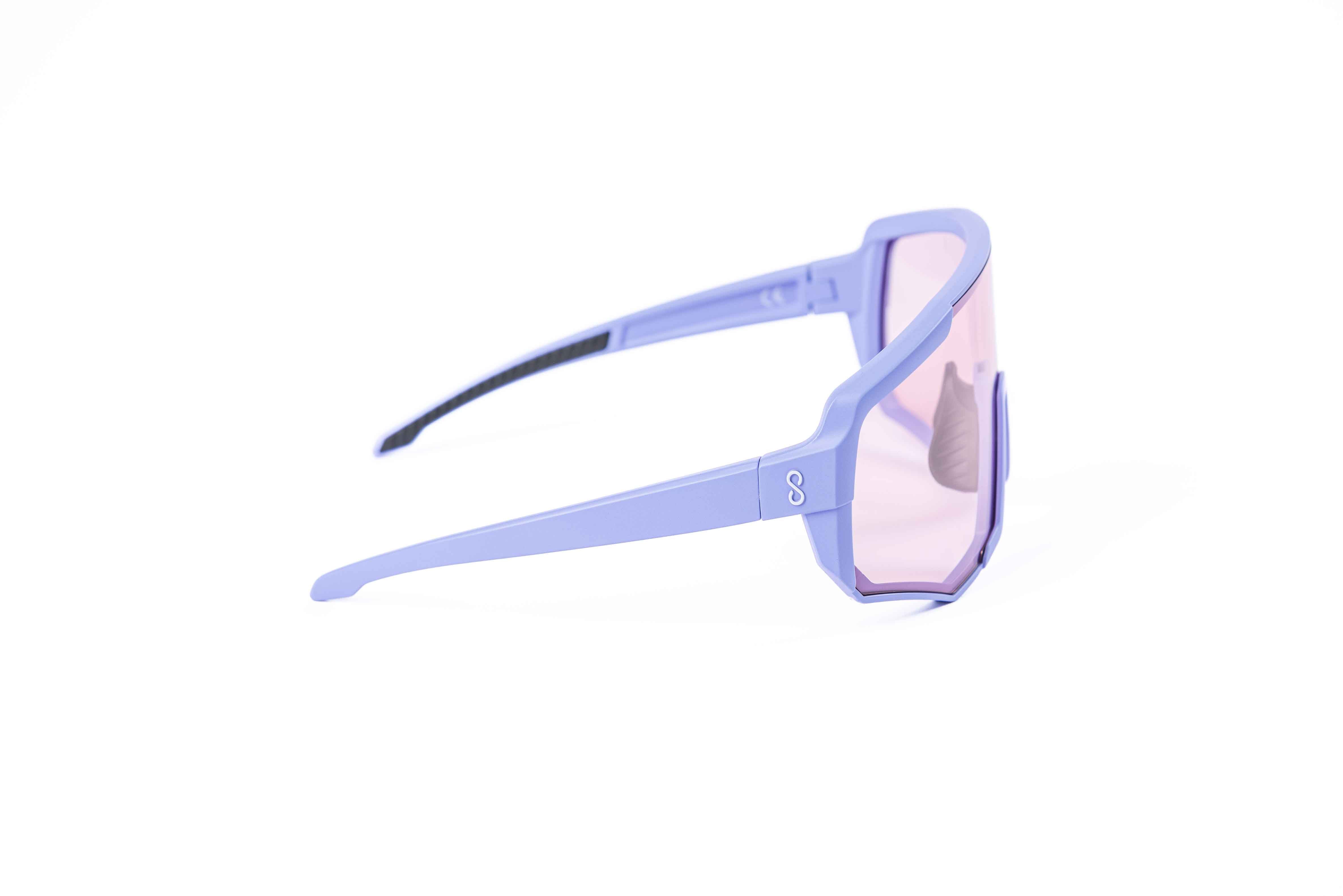 Coast Optics Nita XL MTB riding glasses in purple frame with interchangeable pink crystal lens, designed for trail and enduro riders.