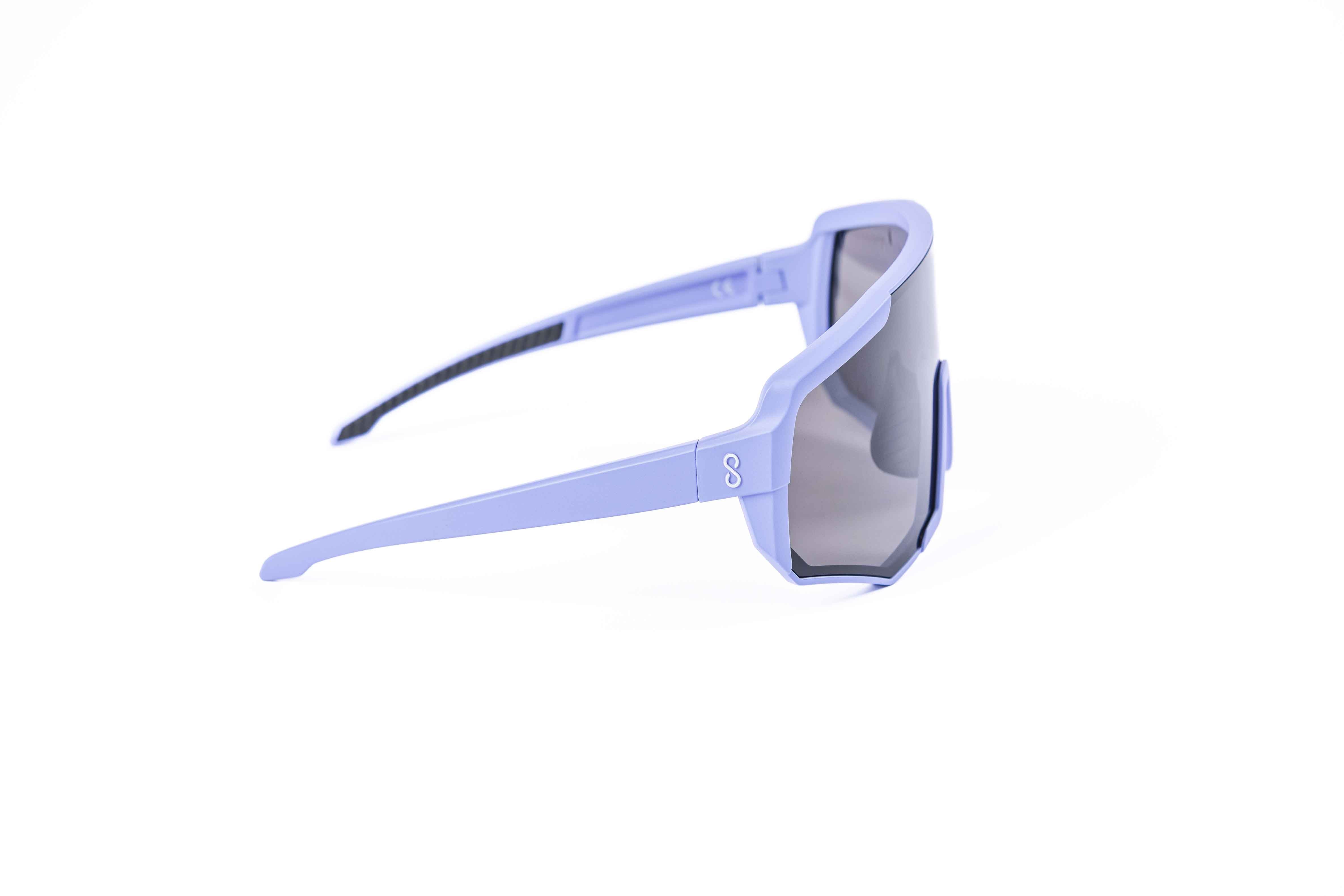 Coast Optics Nita XL MTB riding glasses in purple frame with interchangeable black sun lens, designed for trail and enduro riders.