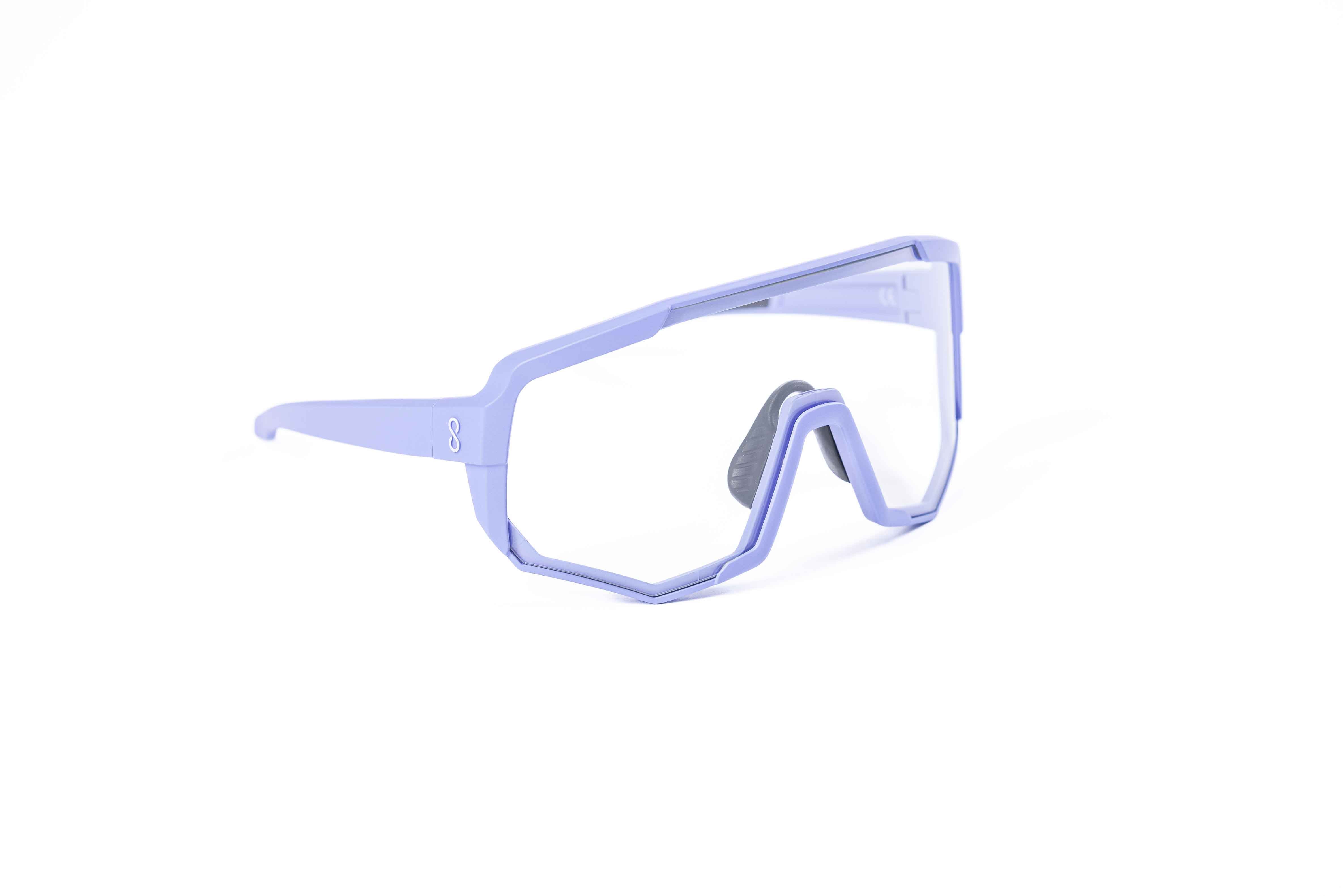 Coast Optics Nita XL MTB riding glasses in purple frame with interchangeable clear lens, designed for trail and enduro riders.