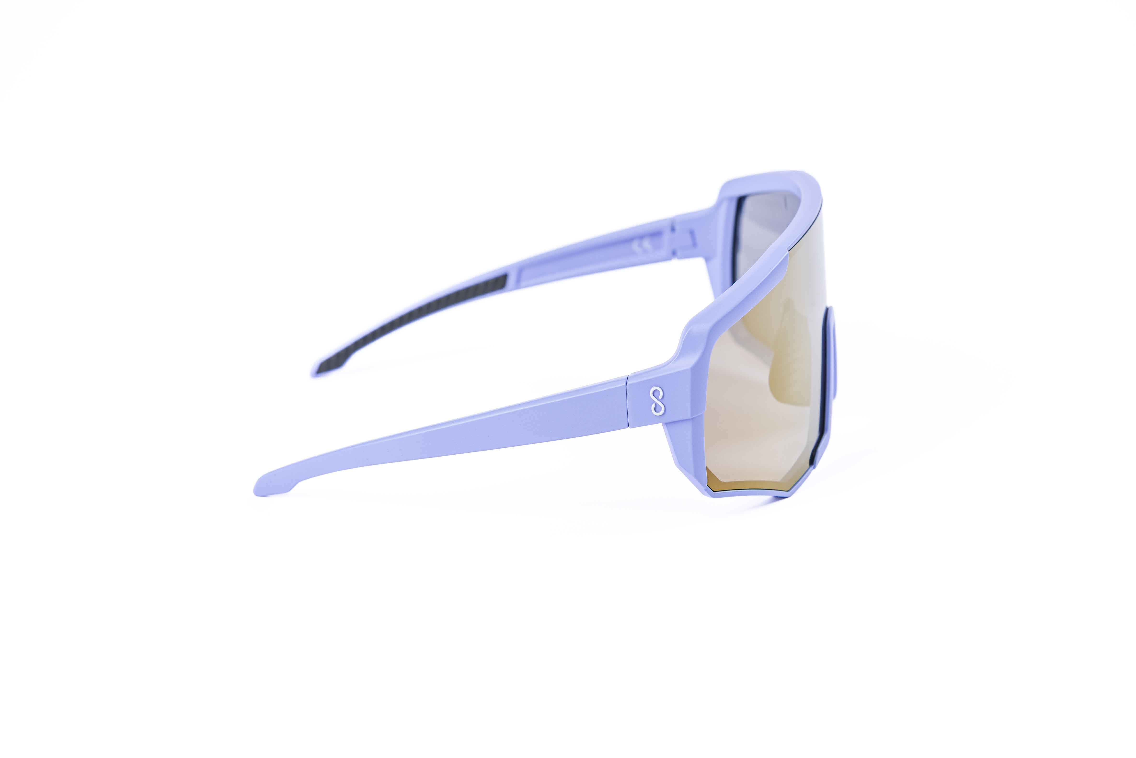 Coast Optics Nita XL MTB riding glasses in purple frame with interchangeable gold sun lens, designed for trail and enduro riders.
