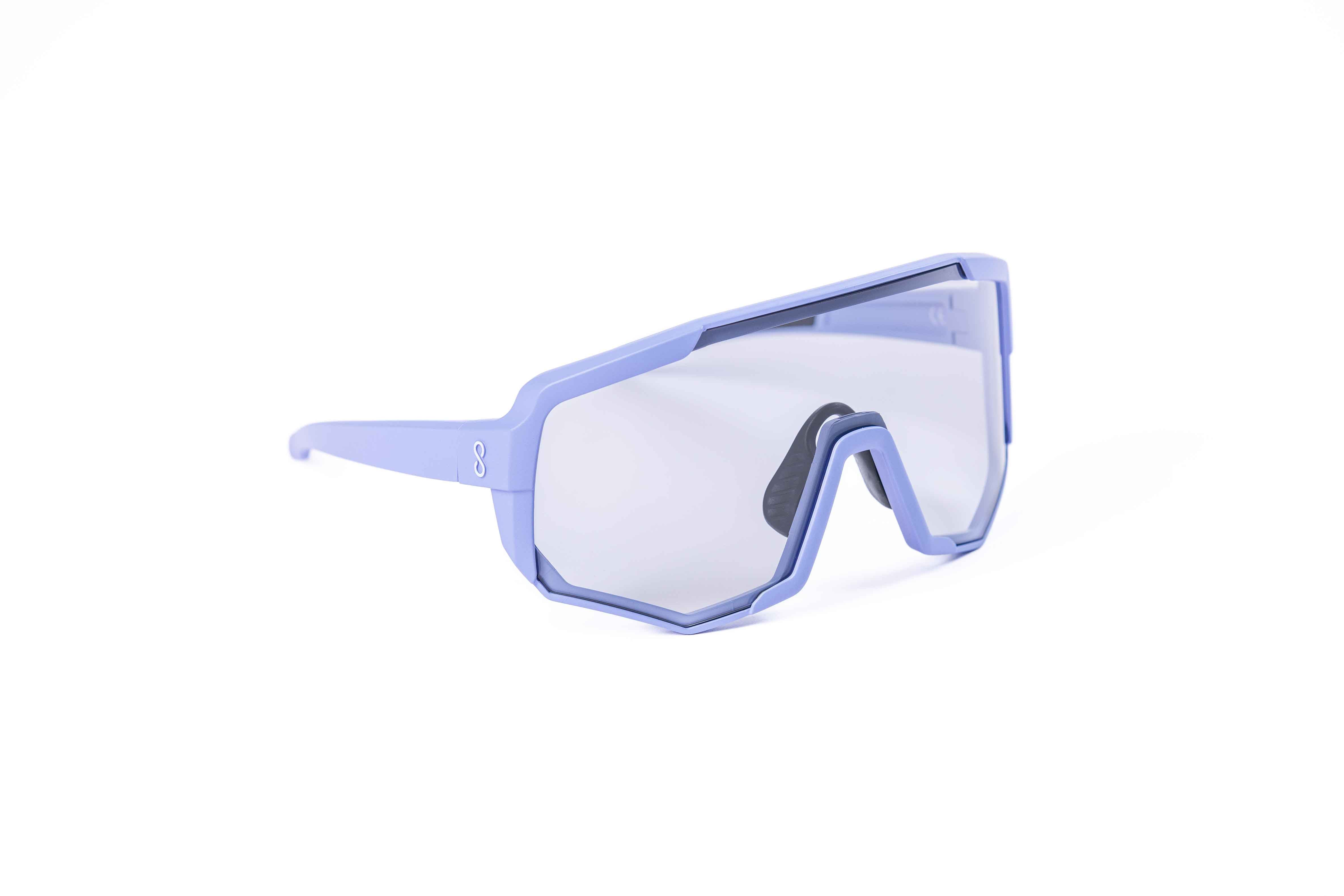 Coast Optics Nita XL MTB riding glasses in purple frame with interchangeable photochromatic lens, designed for trail and enduro riders.