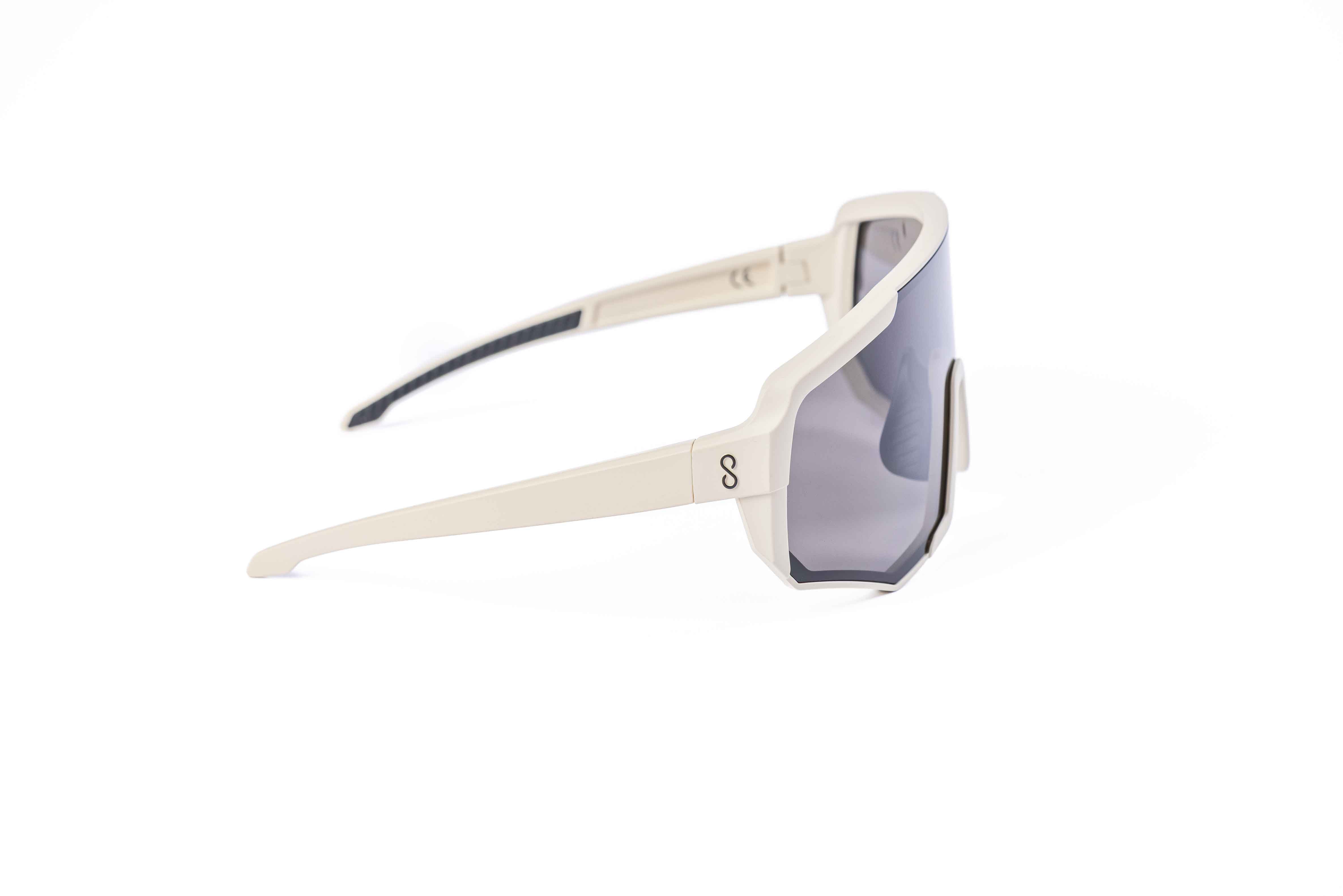 Coast Optics Nita XL MTB riding glasses in beige off-white frame with interchangeable lens, designed for trail and enduro riders.