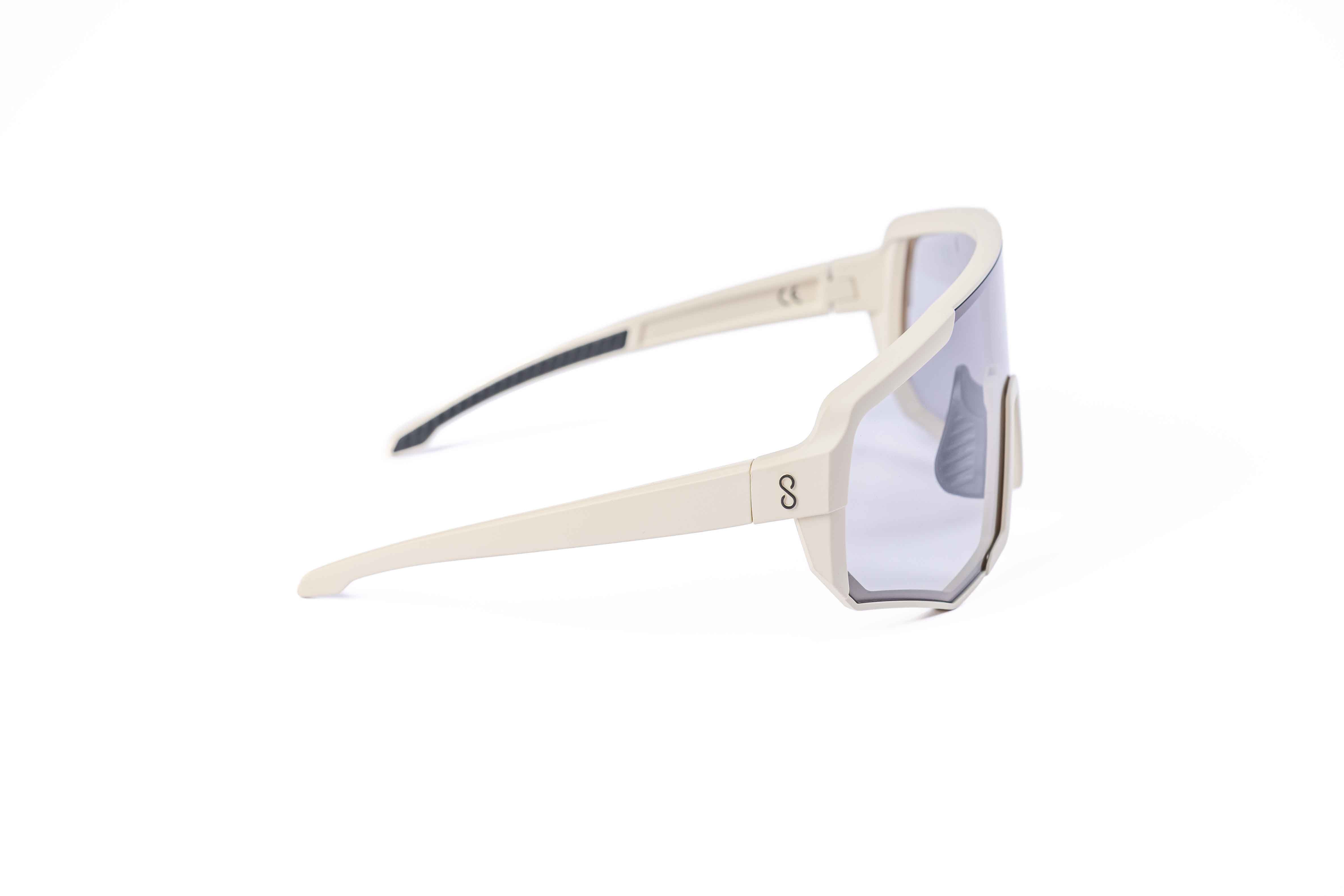 Coast Optics Nita XL MTB riding glasses in beige off-white frame with interchangeable lens, designed for trail and enduro riders.
