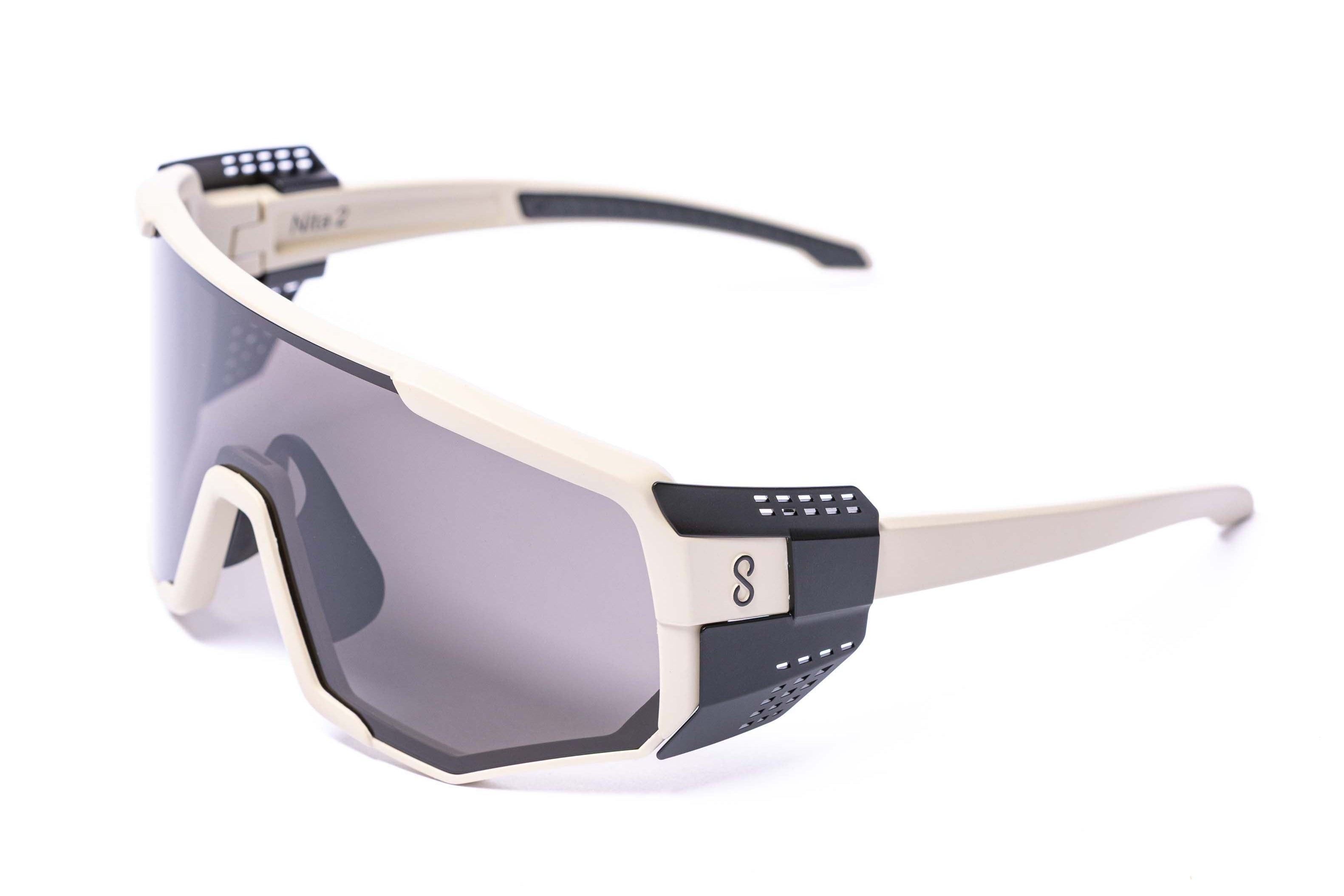 Sunglasses with glacier side shields a Driftwood frame and black sun lenses on a white background