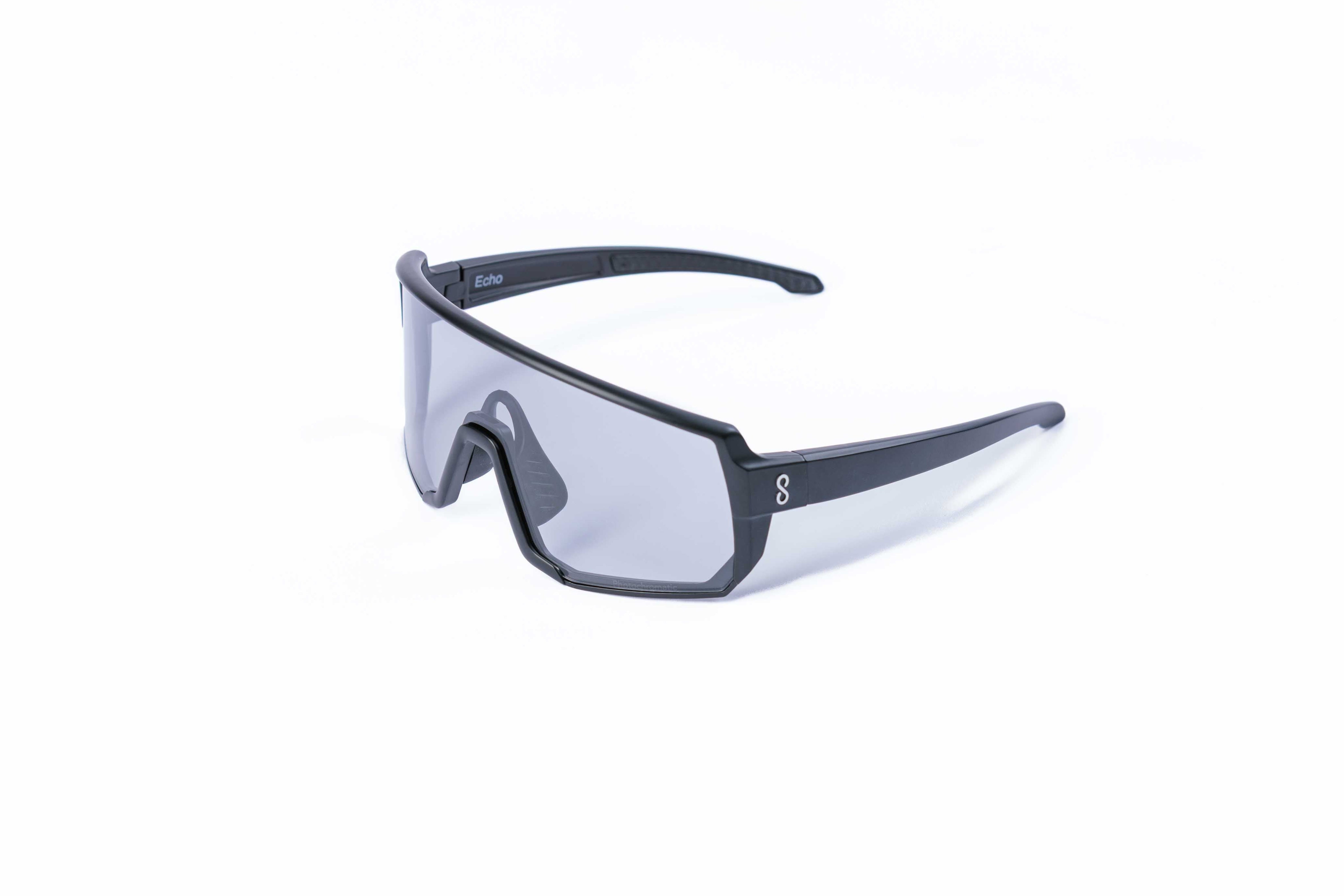 Small size black sunglasses with an interchangeable photochromatic lens on a white background