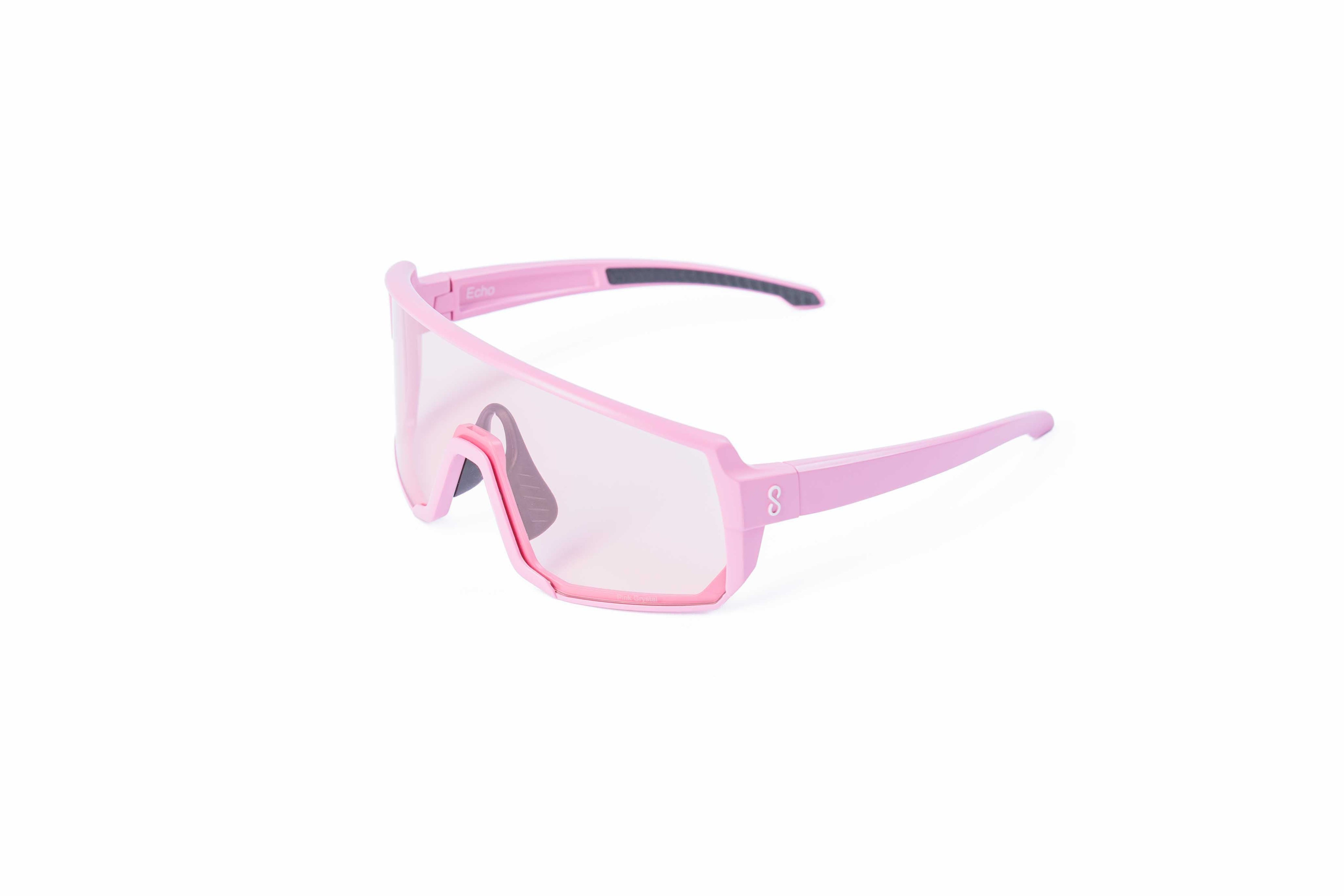 Pink sunglasses with an interchangeable pink lens on a white background