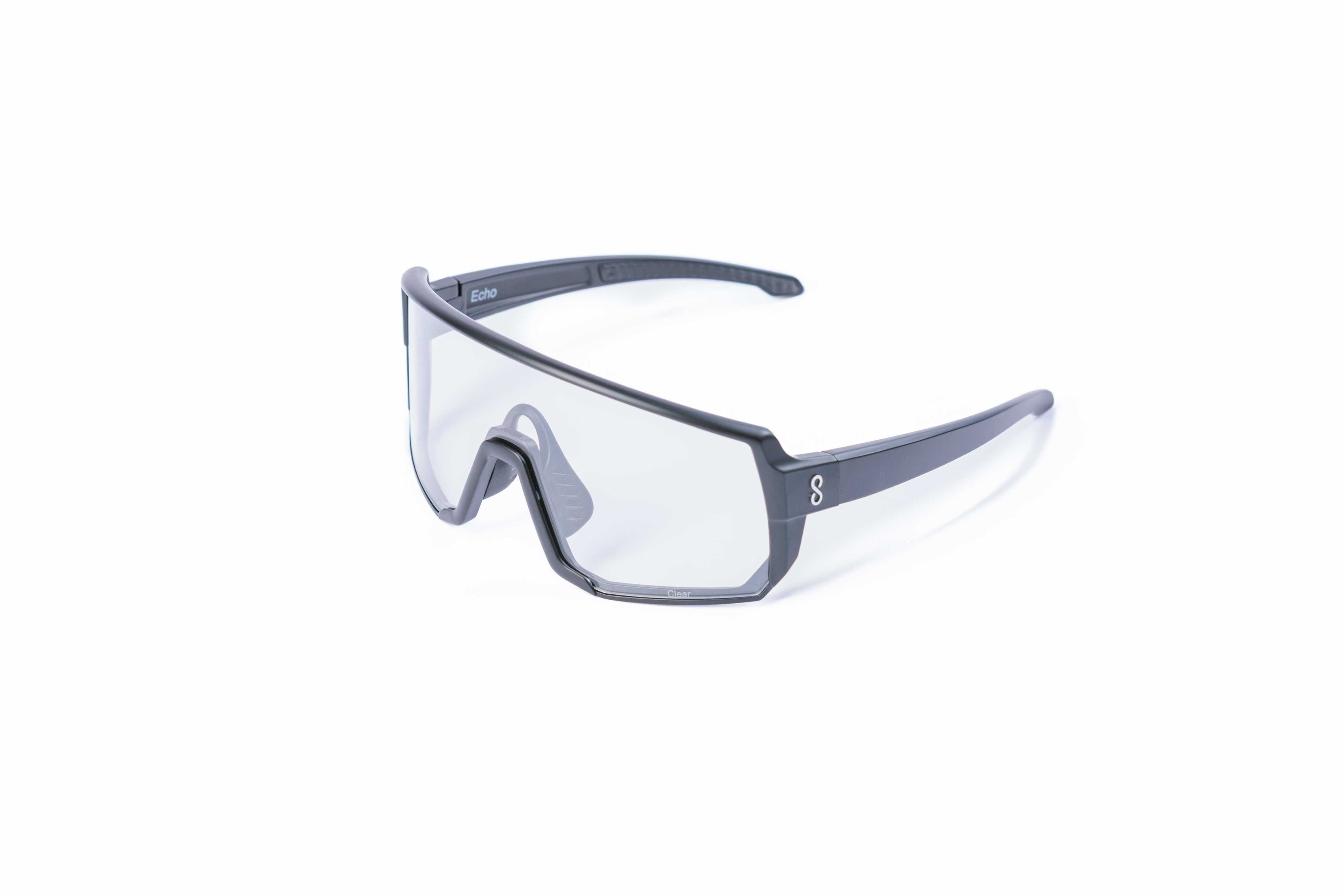 Small size black sunglasses with an interchangeable clear lens on a white background