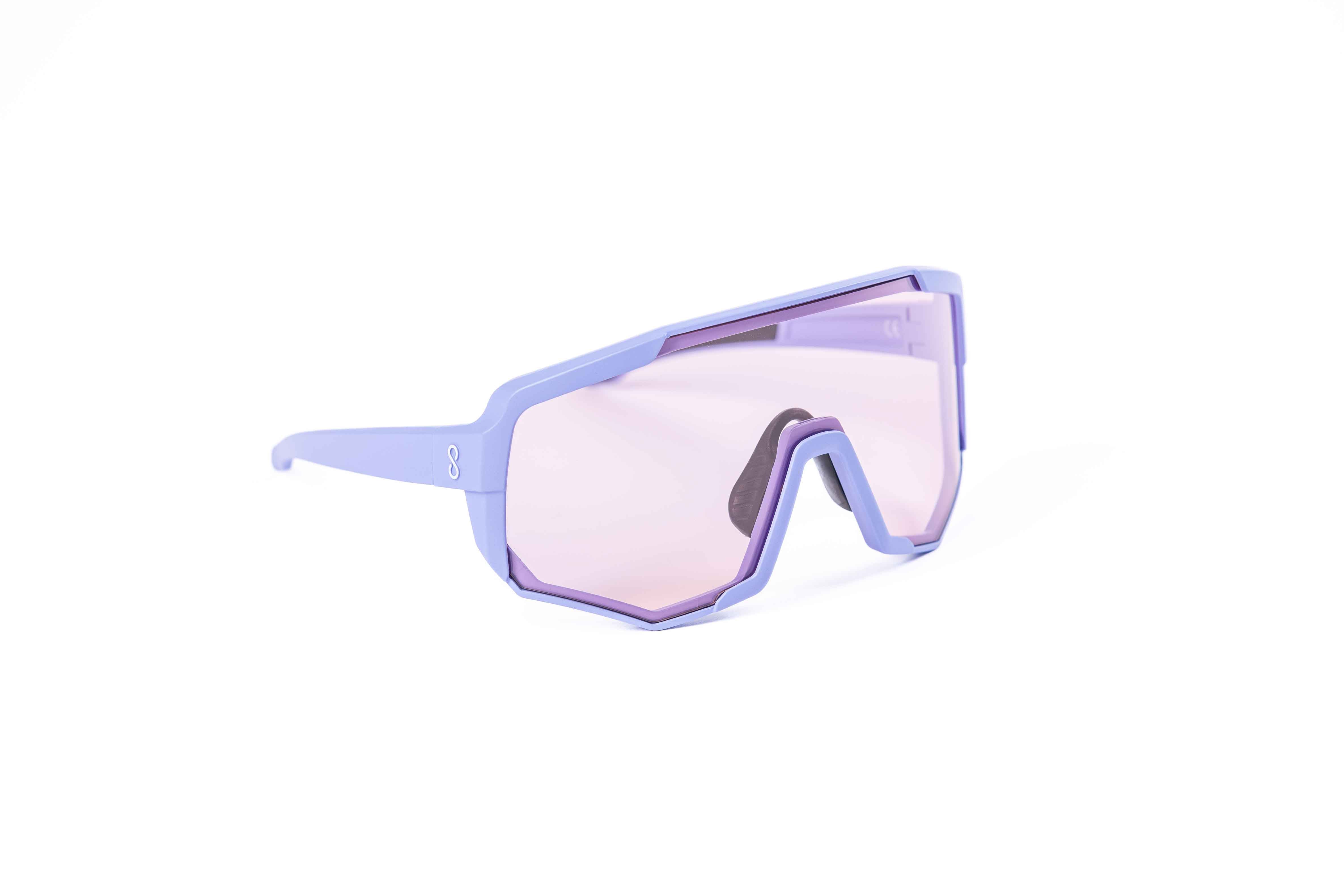 Coast Optics Nita XL MTB riding glasses in purple frame with interchangeable pink crystal lens, designed for trail and enduro riders.