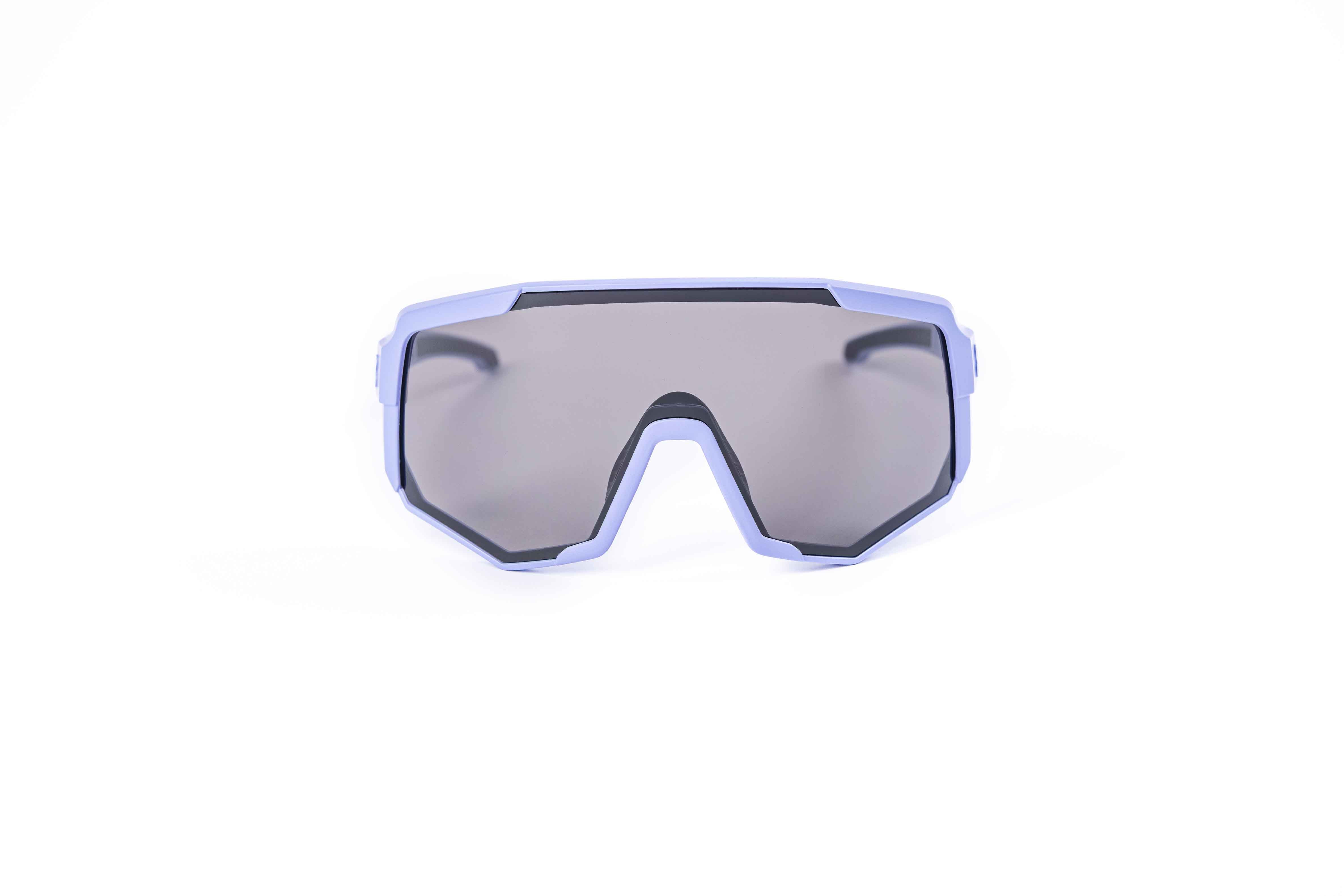 Coast Optics Nita XL MTB riding glasses in purple frame with interchangeable black sun lens, designed for trail and enduro riders.