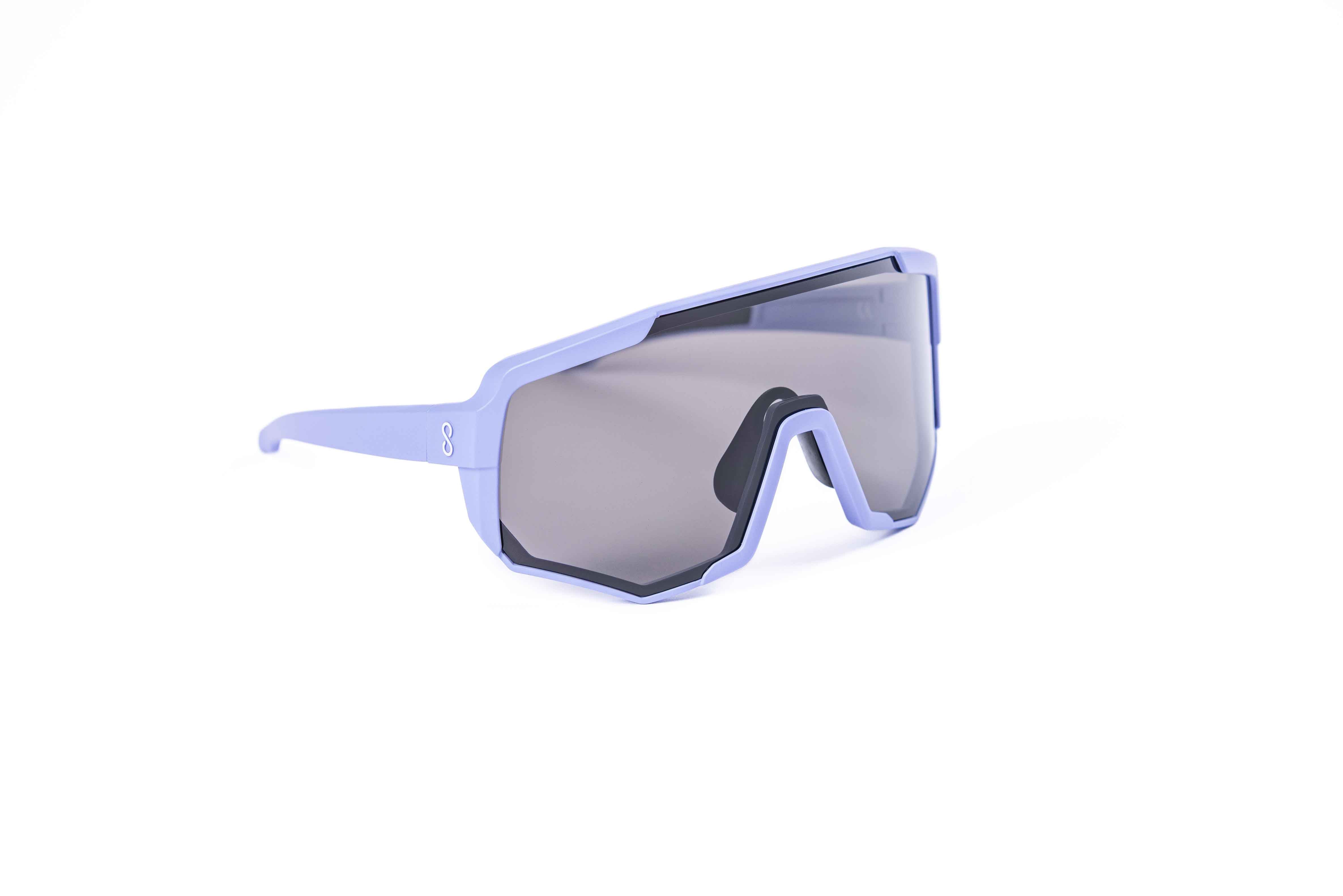 Coast Optics Nita XL MTB riding glasses in purple frame with interchangeable black sun lens, designed for trail and enduro riders.