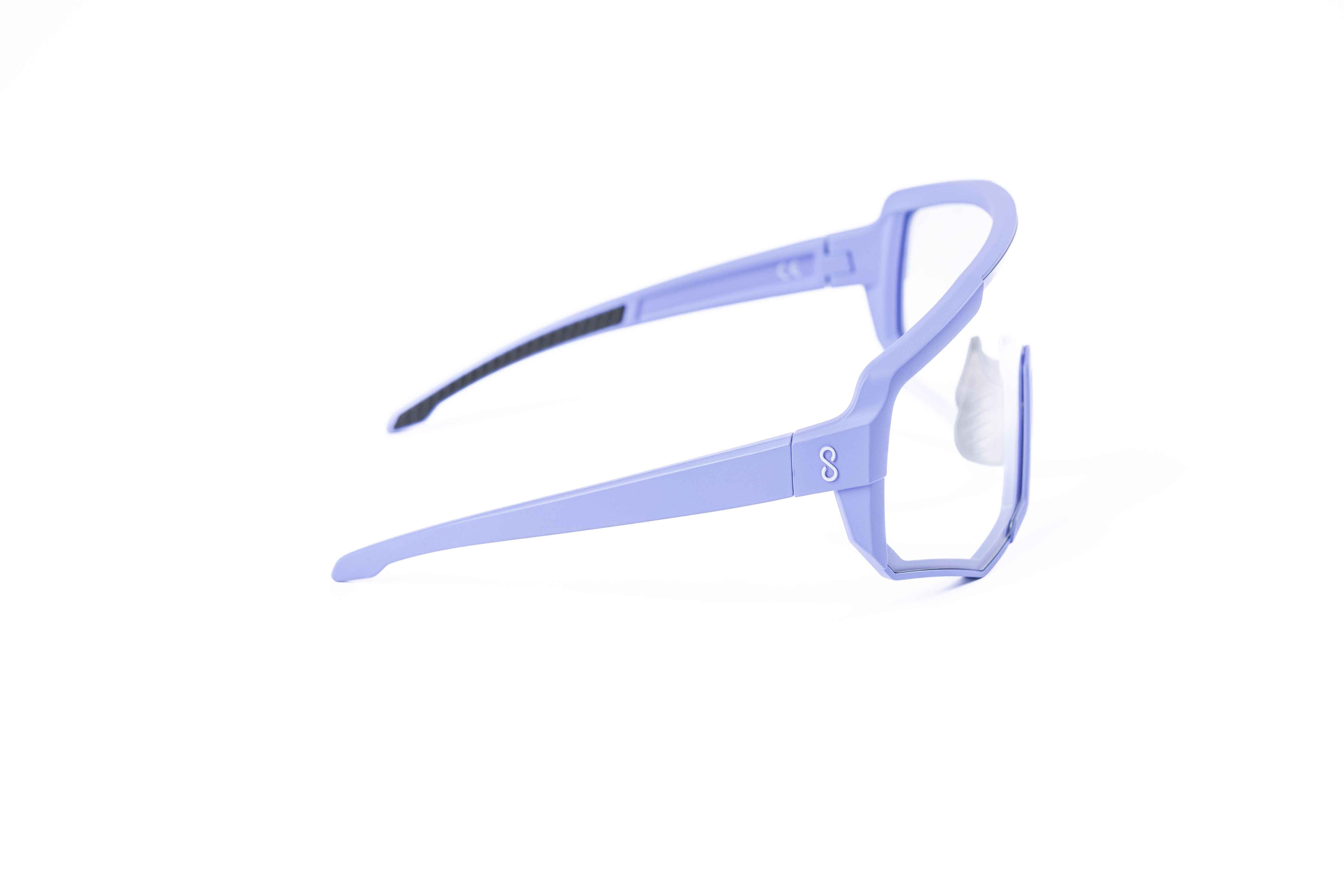 Coast Optics Nita XL MTB riding glasses in purple frame with interchangeable clear lens, designed for trail and enduro riders.