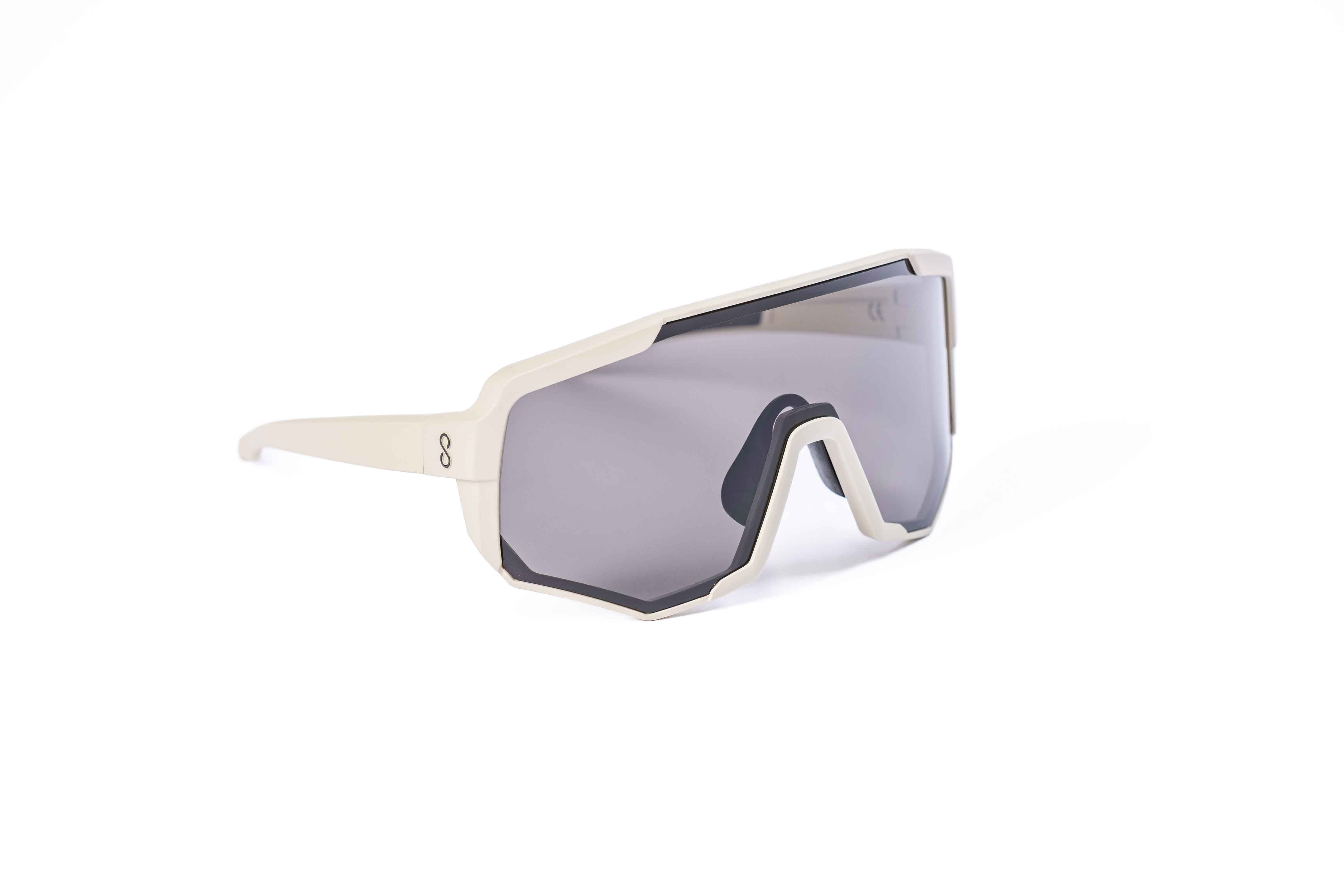 Coast Optics Nita XL MTB riding glasses in beige off-white frame with interchangeable lens, designed for trail and enduro riders.