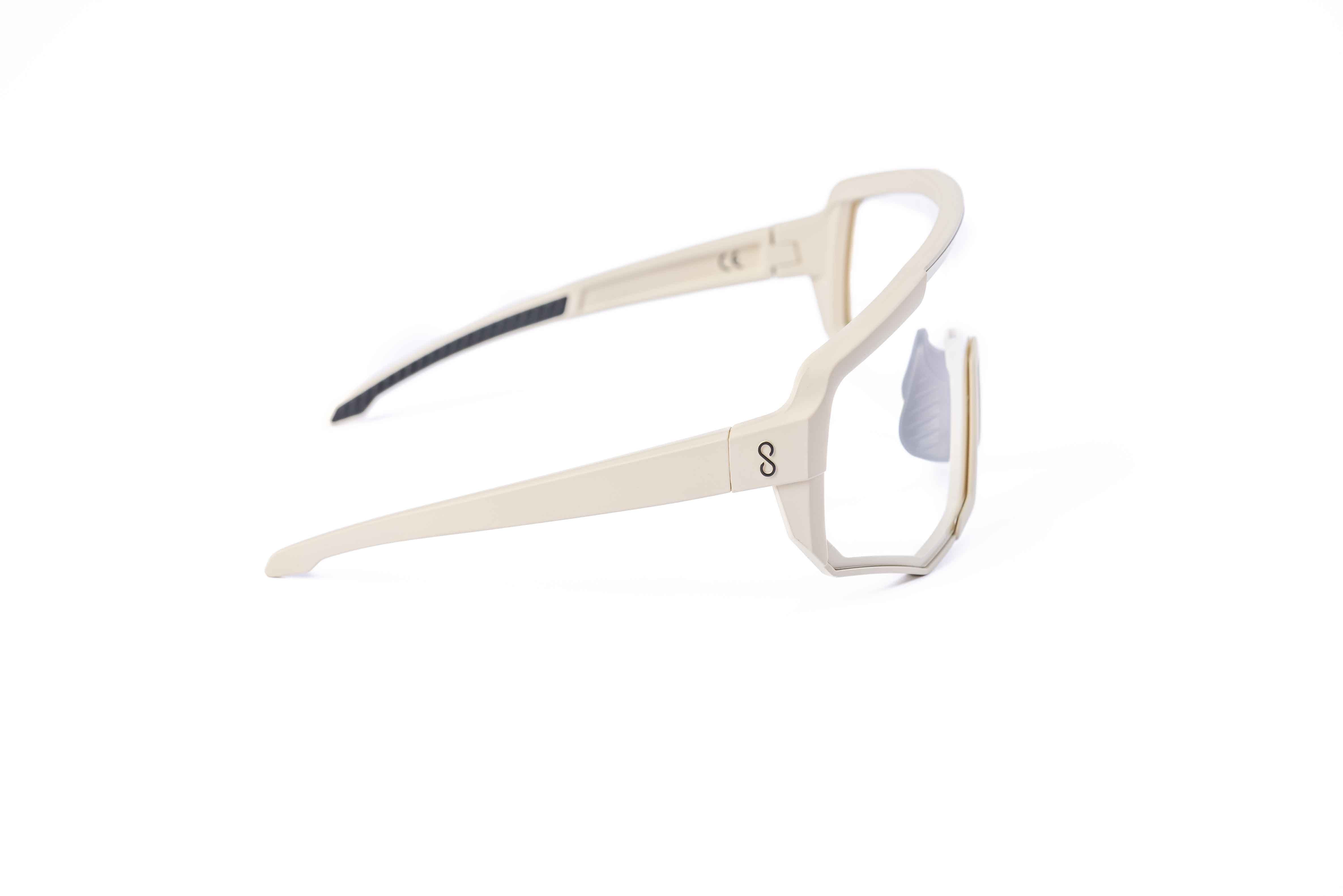 Coast Optics Nita XL MTB riding glasses in beige off-white frame with interchangeable lens, designed for trail and enduro riders.