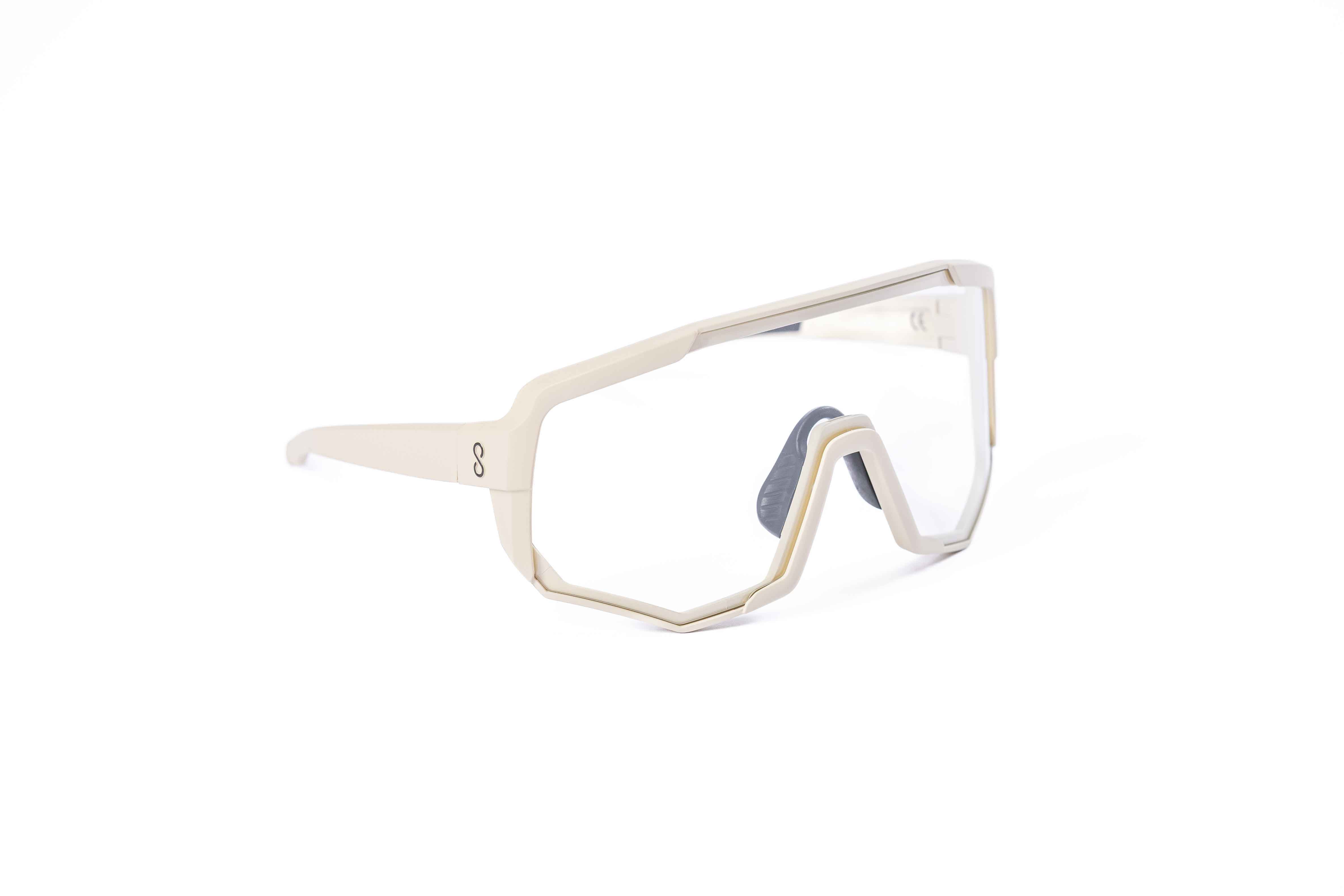Coast Optics Nita XL MTB riding glasses in beige off-white frame with interchangeable lens, designed for trail and enduro riders.